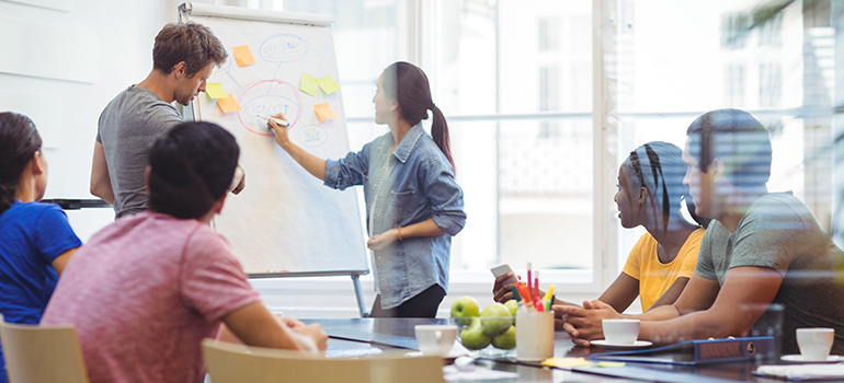 A meeting of experts discussing SEO agency vs. an in-house SEO team