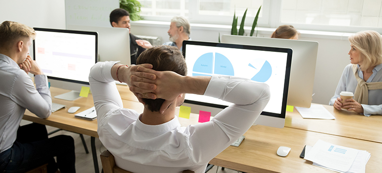 People in an office discussing SEO agency vs in-house SEO