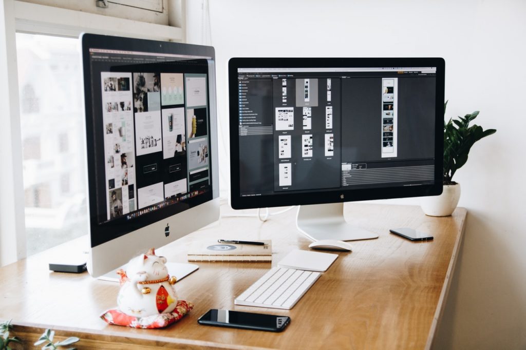 Modern desktop workspace showing graphic design assets for social media branding.