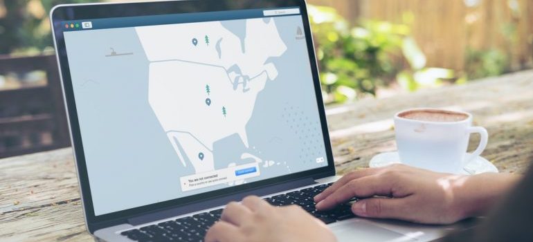 Map with location pins on laptop