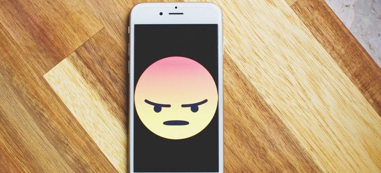 Image of unhappy emoji on iPhone