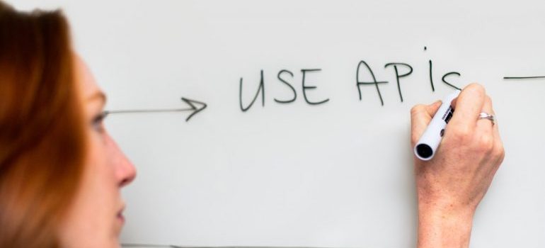 Woman writing a development plan for an app
