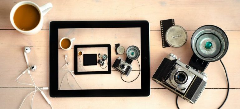 Kodak camera next to iPad.