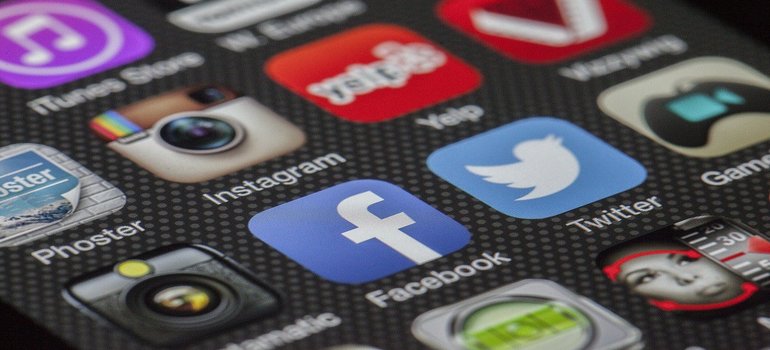 Social media icons on a smartphone screen.