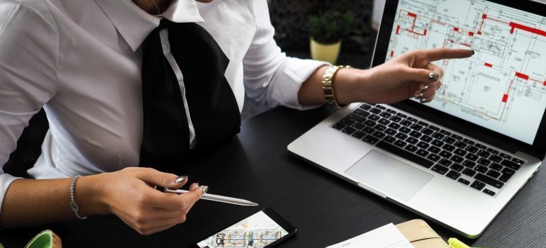 A realtor using a laptop