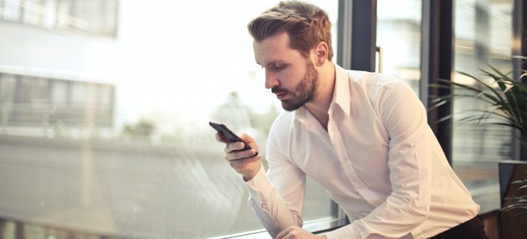 a man using a mobile device
