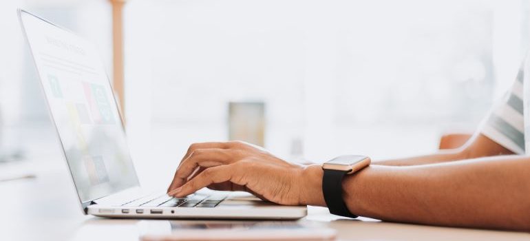 Person creating content on laptop.