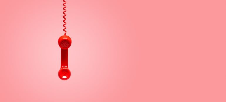 Red phone hanging loose.