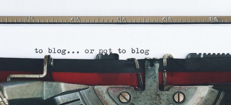 a typewriter with words to blog or not to blog typed on a piece of paper