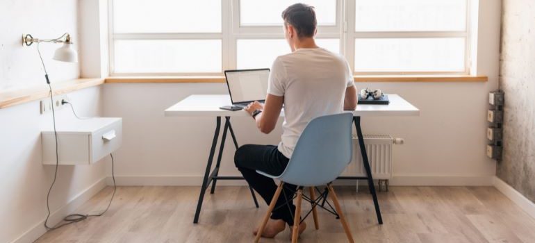 Person looking at laptop.
