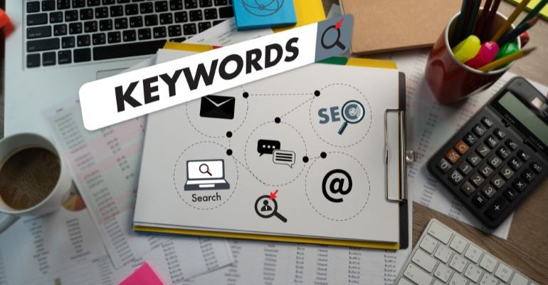 Work desk with an illustration of Keywords on it.