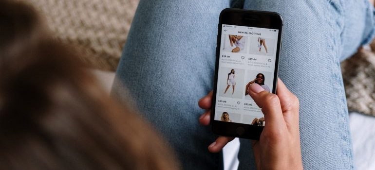 a girl doing online shopping via mobile device