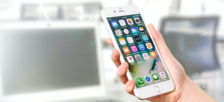 a hand holding a cell phone