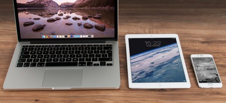 a laptop, an ipad and a cell phone
