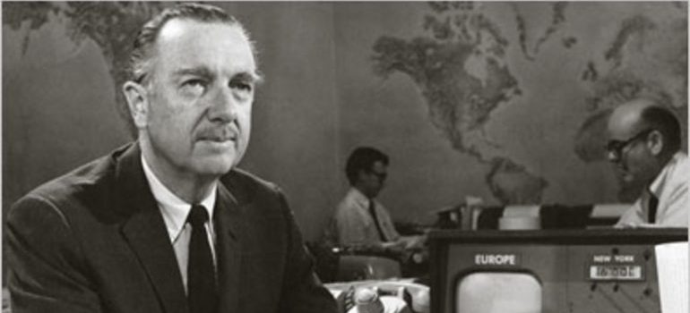 A black-and-white photograph of Walter Cronkite in a suit.