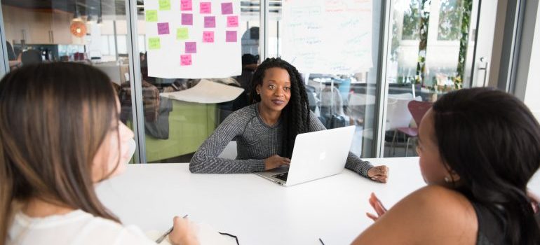 coworkers talking in an office