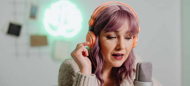 Female influencer boosting your social media following by promoting products.