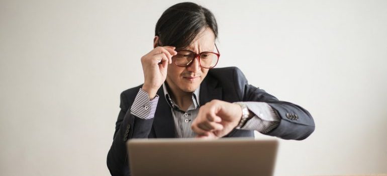 Man working at a computer is worried.
