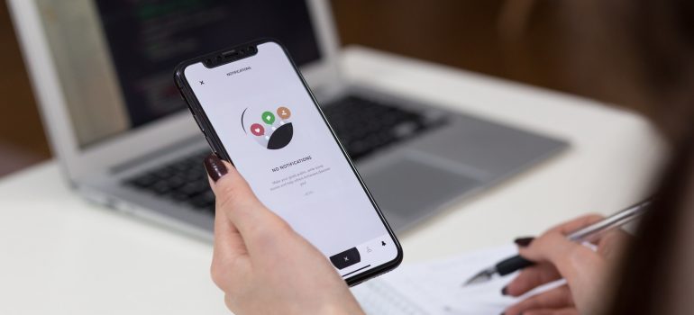 User checking business app for new notifications.