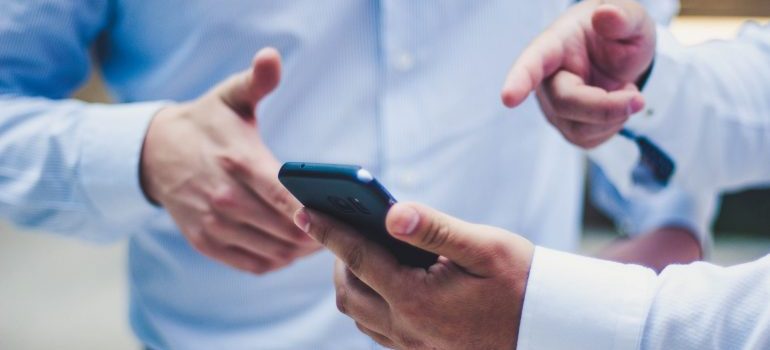 Employees discussing important features of the app for your business.