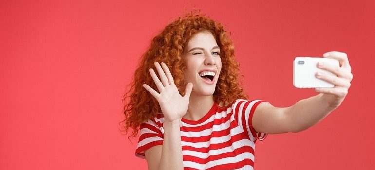 Woman taking selfie for TikTok