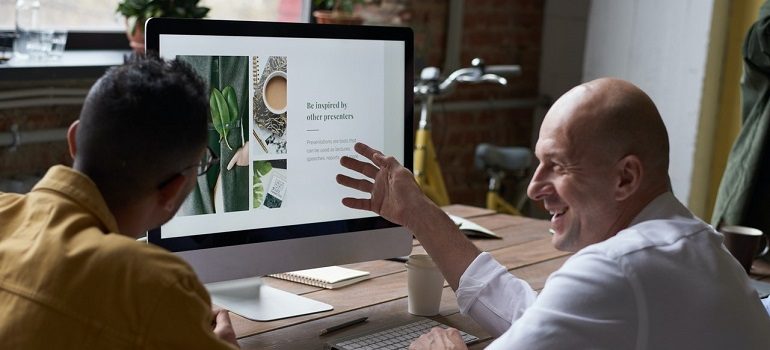 Business owners brainstorming ideas for digital marketing.