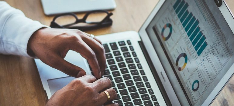 Designer inspecting website audit metrics.