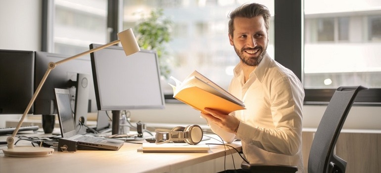 Man looking over his shoulder in the office.