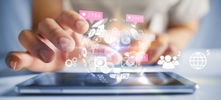 Vector image of social media elements above a smartphone.