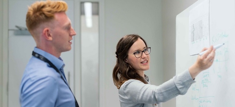 Woman explaining the benefits of Account-based marketing to client.