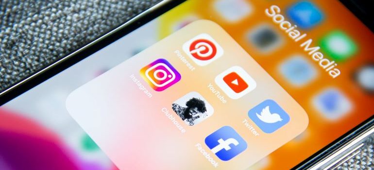 iPhone with social media folder opened on it