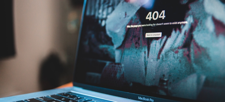 Photo of a MacBook pro screen with a 404 page on it