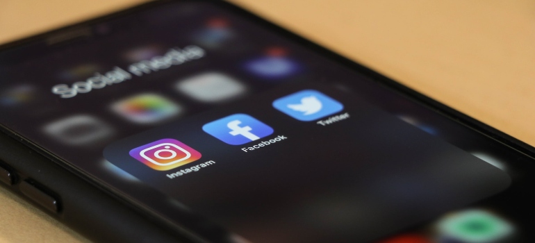 iPhone with a social media folder opened on it