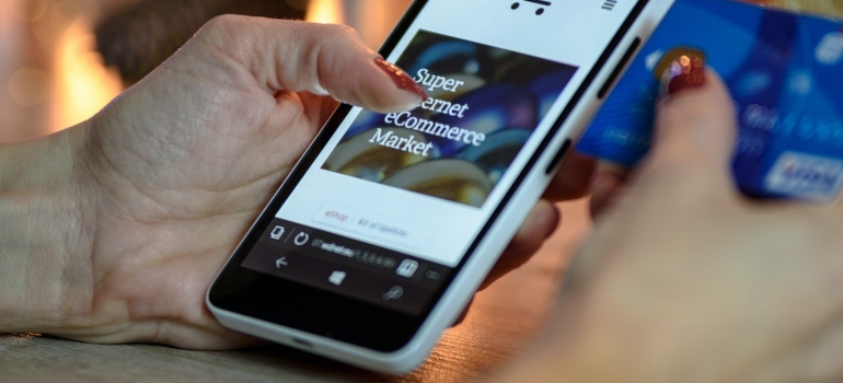 Person using a smartphone to purchase something online