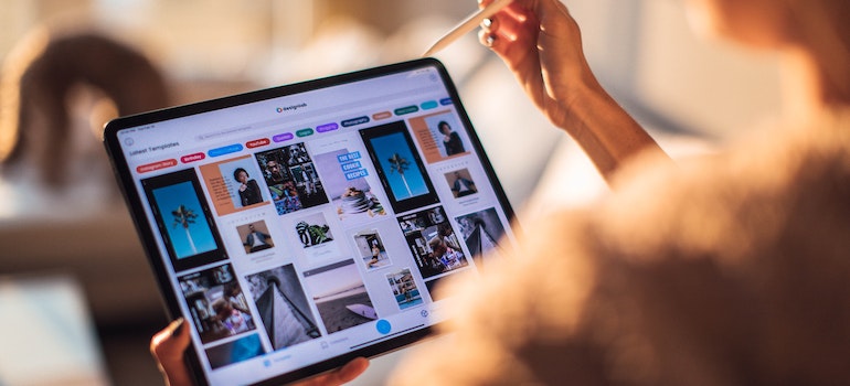 A woman holding a tablet