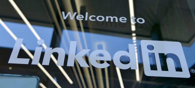 A sign on a door that says ''welcome to LinkedIn''.