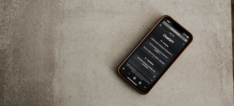 Phone with ChatGPT opened on it on the floor