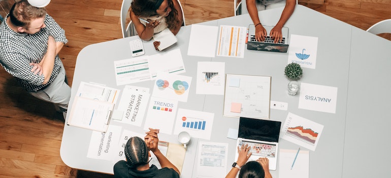 A group of people working on a digital marketing strategy.