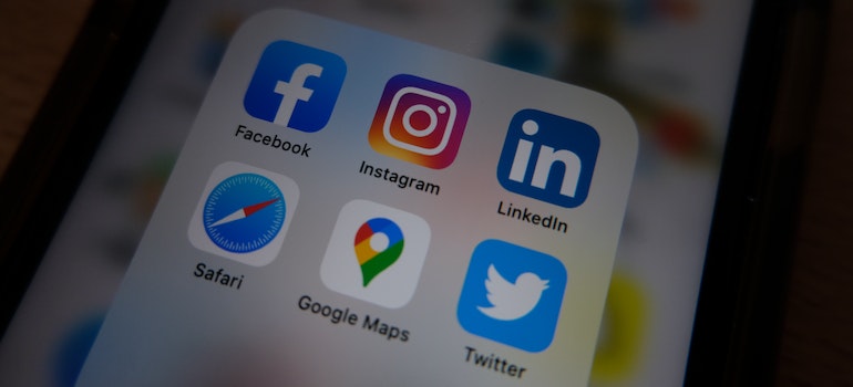 A phone with a few apps icons on the screen