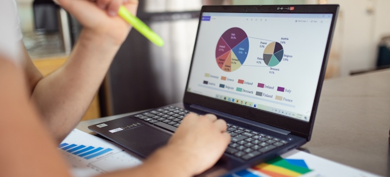 Person analyzing data on their laptop