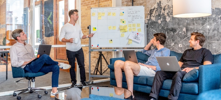 Group of people in an office discussing full funnel marketing