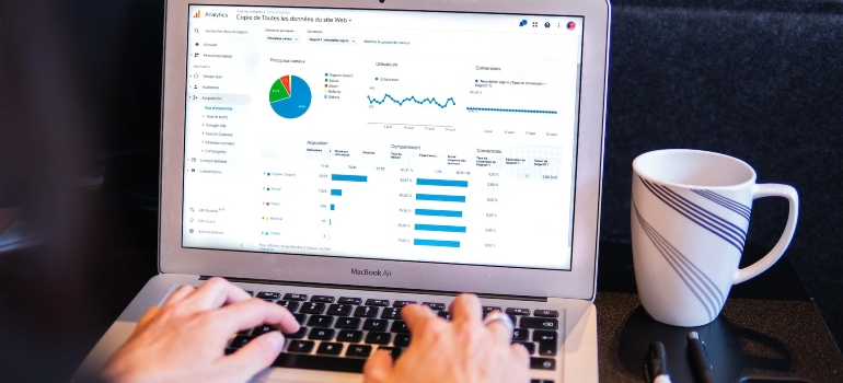 Person using a laptop to analyze data after an email marketing campaign