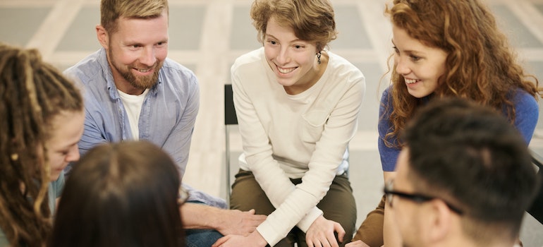 A group of people engaging in a group conversation