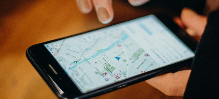 A close-up of a person using Google Maps on a smartphone, illustrating the importance of a mobile-first marketing strategy for addiction treatment centers.
