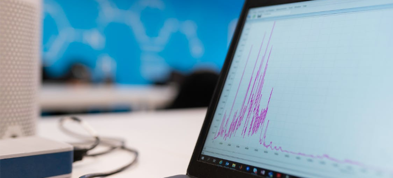 A close-up of a laptop screen featuring a graph.