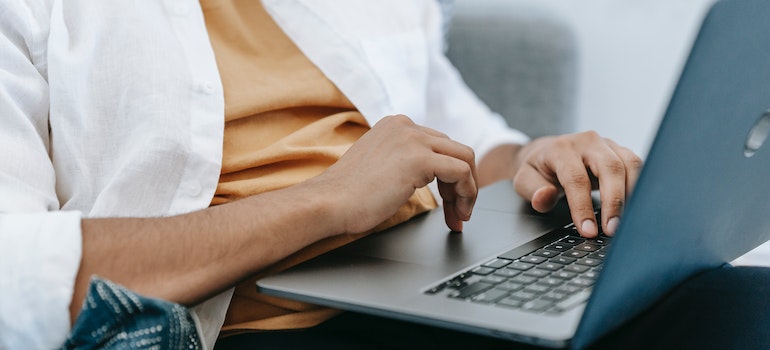A young adult using a laptop securely, which is should be respected when marketing addiction treatment to young adults