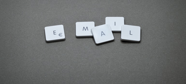 The word email written on a grey surface. 