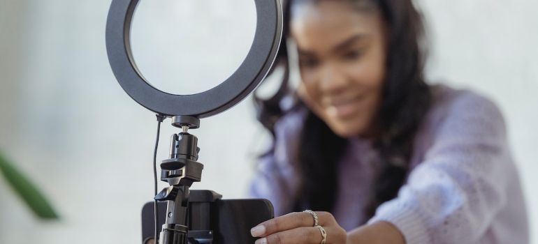 Influencer setting up their equipment to record content