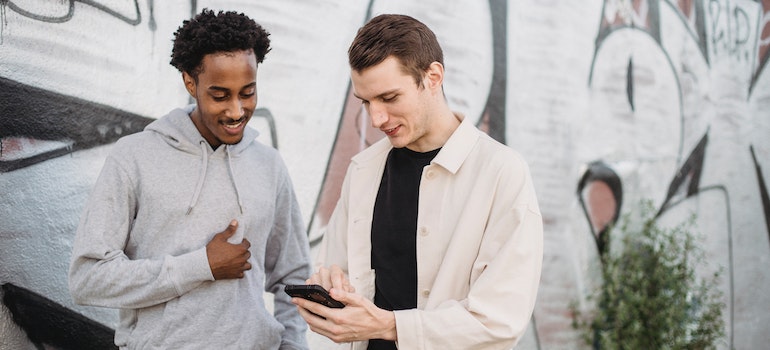 Two people using a smartphone