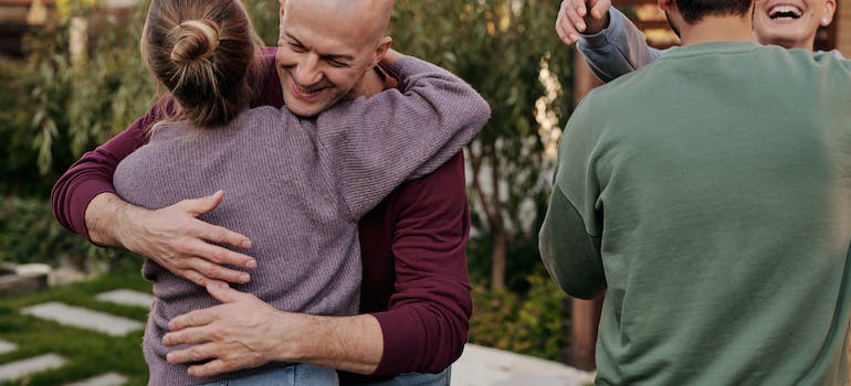A family hugging and supporting each other, which is why family involvement in alcohol rehab marketing is important